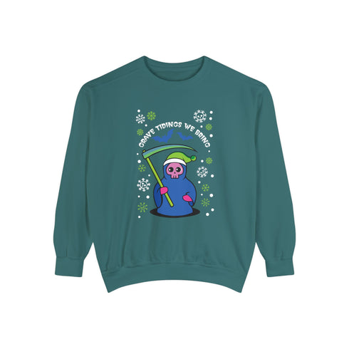 A holiday sweatshirt featuring a cute Grim Reaper holding a scythe, wearing a Santa hat. Above the character is the text "Grave Tidings We Bring," surrounded by festive snowflakes and holiday-themed designs. The combination of spooky and festive elements adds a humorous twist to traditional holiday attire.